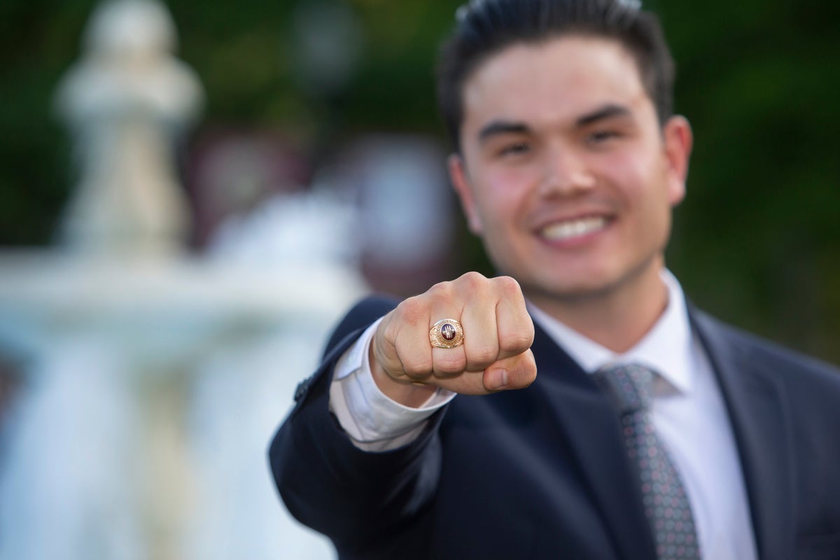 A Florida State student trying on their class ring during the Ring Ceremony.